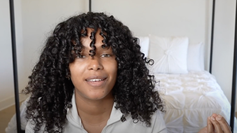 Here's How To Rock Curtain Bangs With Curly Hair Here's How To Rock Curtain Bangs With Curly Hair