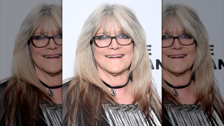 Susan Olsen pictured in 2023 wearing glasses