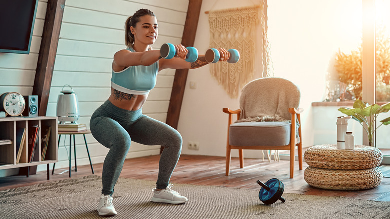 Woman gently exercises at home