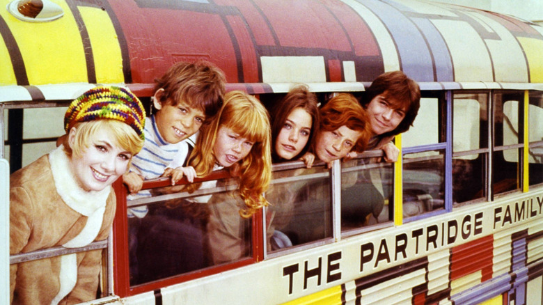 A 1970s promo shot of the stars of The Partridge Family in the bus
