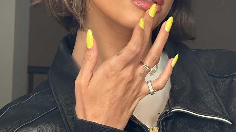 Hailey Bieber with yellow nails