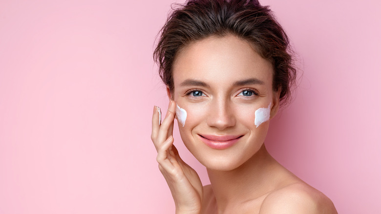 Woman applying cream