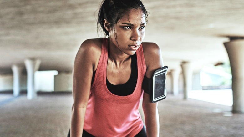 Sweaty Black woman exercising