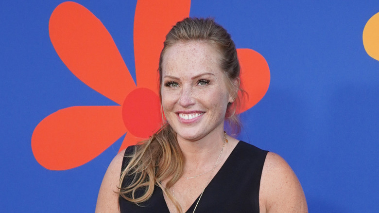 Mina Starsiak Hawk poses on the red carpet