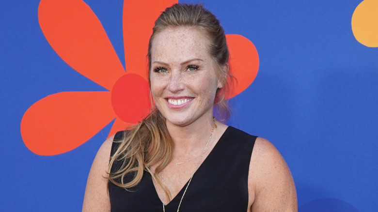 Mina Starsiak Hawk poses on the red carpet