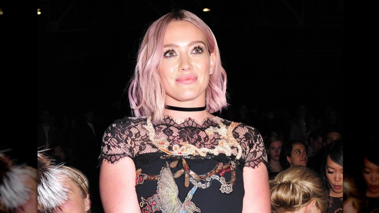 Hilary Duff surrounded by people in 2016