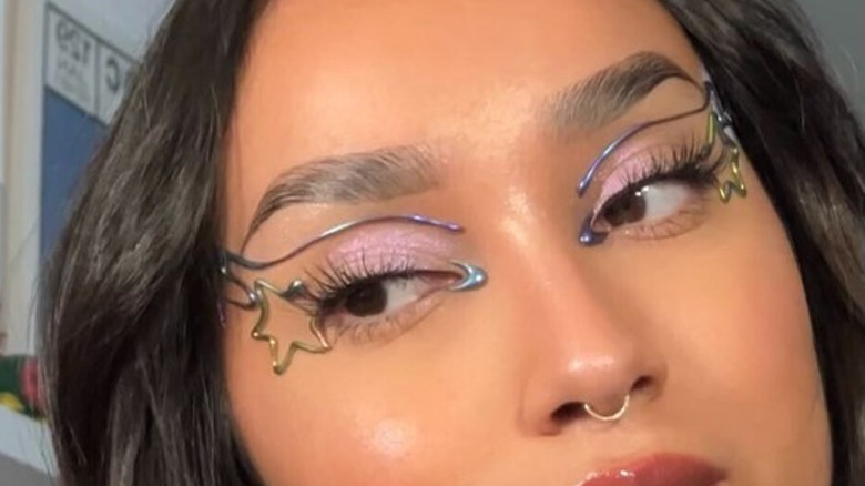 woman with hot glue eyeliner