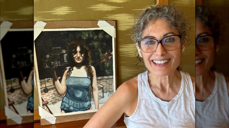 Lisa Edelstein poses with her art in August 2025