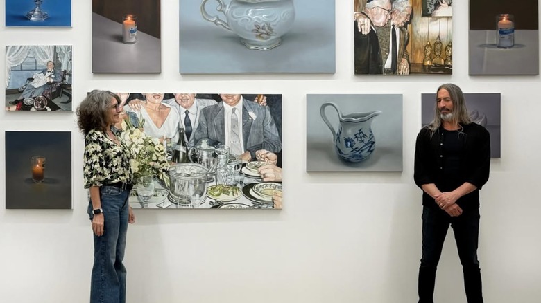Lisa Edelstein in front of her art with Robert Russell in June 2026