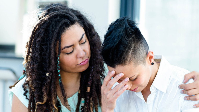 woman comforting her partner