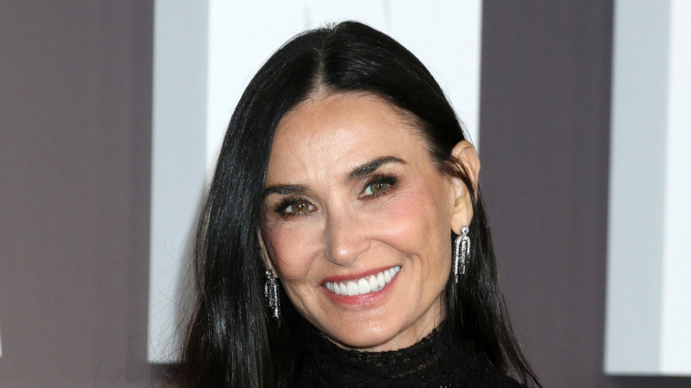 Demi Moore in a black dress smiling for a photo at the  Landmark Paramount+ Series Premiere