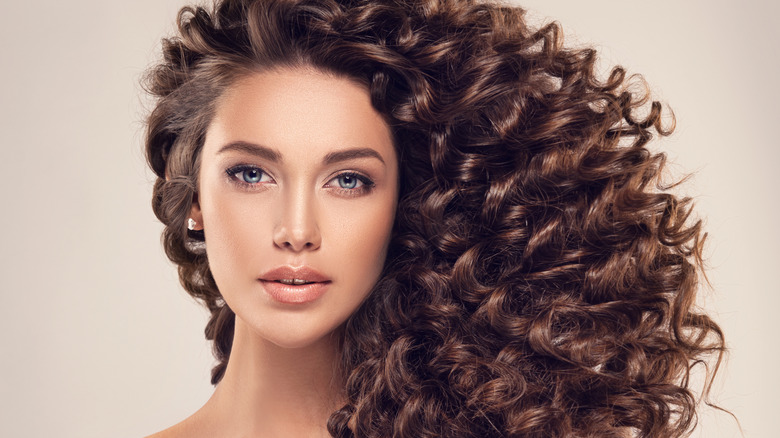 A woman with healthy, curly hair 