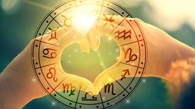 heart hands and zodiac wheel