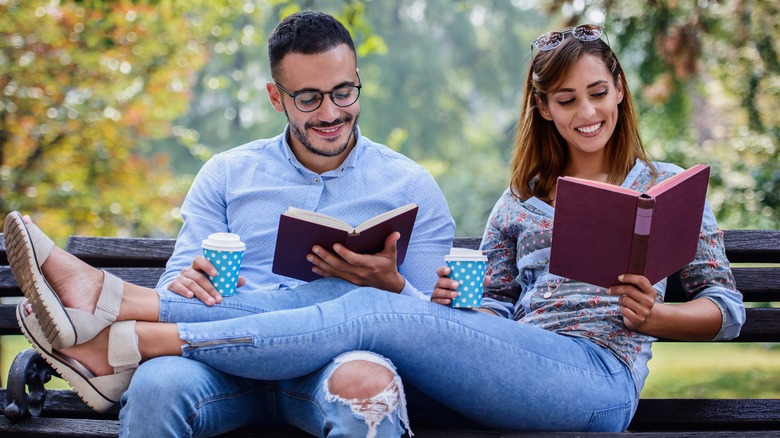 young couple reading books together