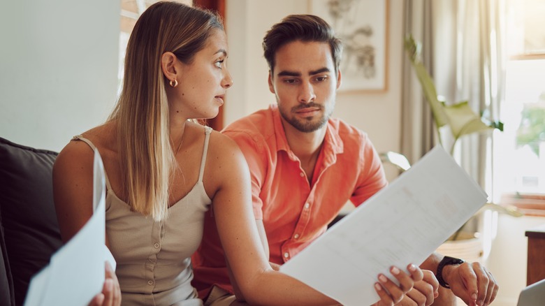 couple looking at bank statements