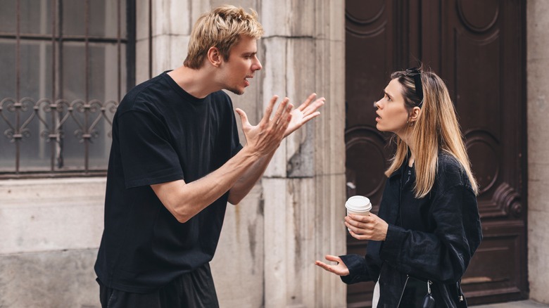 Two people arguing outside