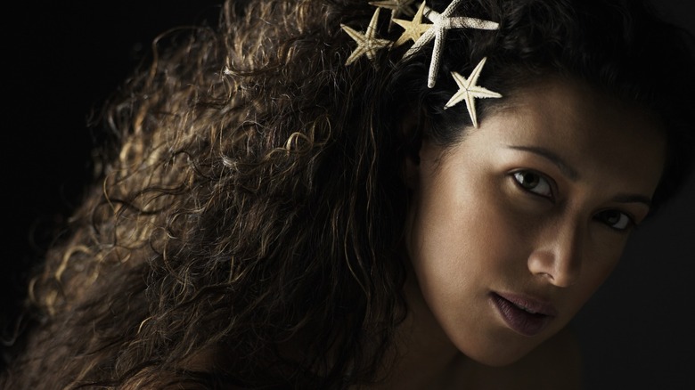 Woman with starfish in hair