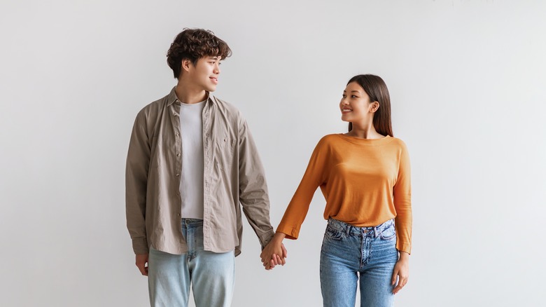 couple smiling and holding hands