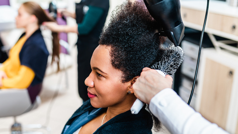 woman with curly hair at salon