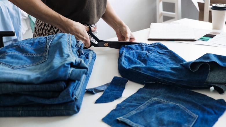 denim jeans being cut