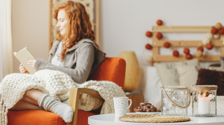 Woman at home with fall decor