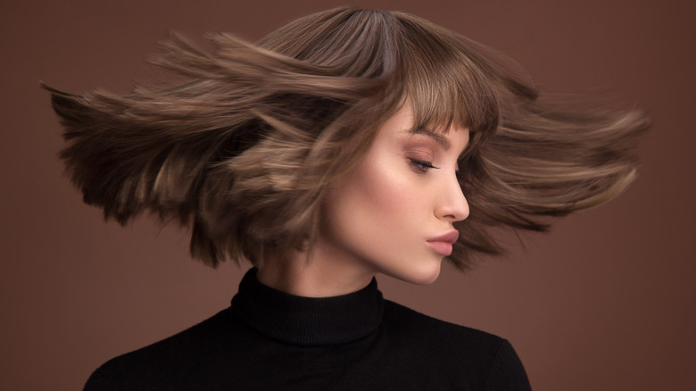 A woman showing off her hair