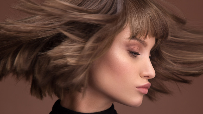 young woman with wolf cut haircut