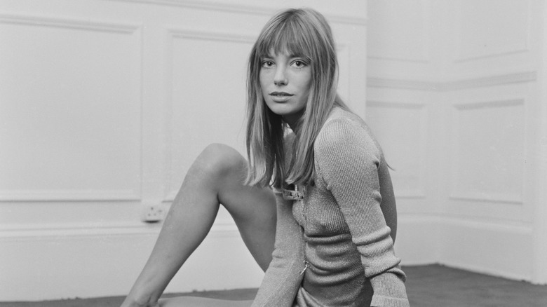 Jane Birkin posing on ground 