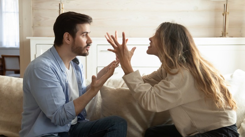 couple arguing on couch