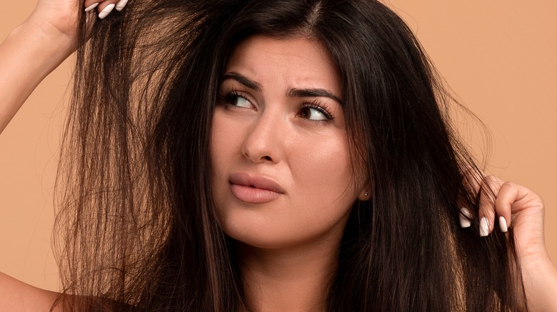 A woman with frizzy hair 