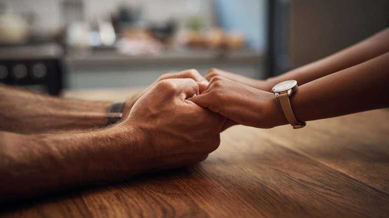 Couple holding hands