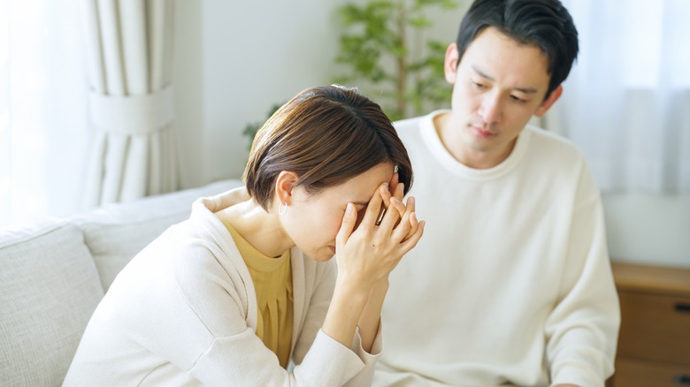 Man comforts crying friend