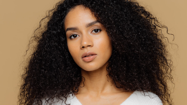 Woman with long curly hair