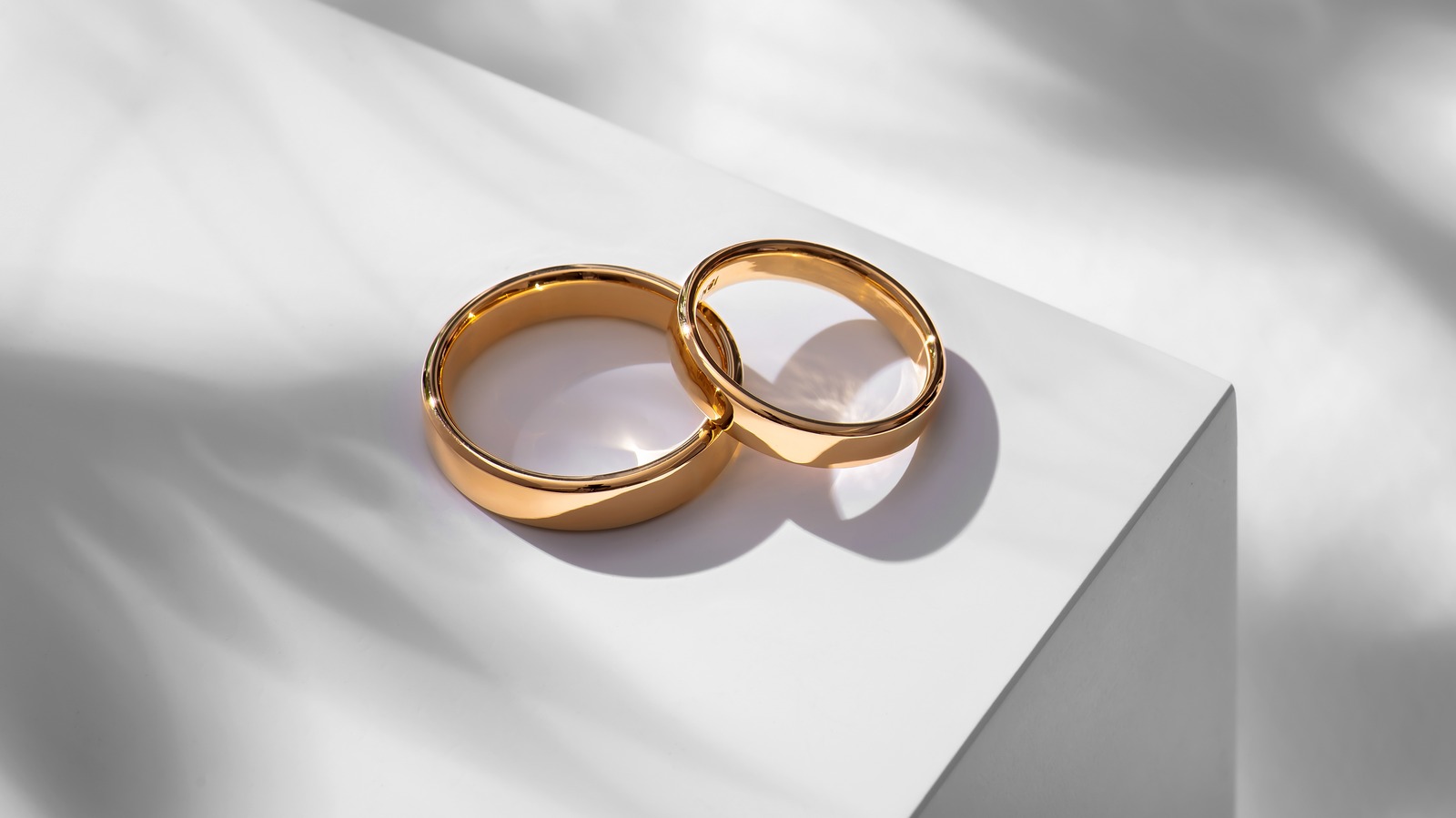 A Pair Of Gold Wedding Rings With Bokeh Background Stock Photo, Picture and  Royalty Free Image. Image 32712546.