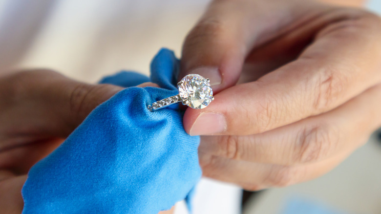 A ring being held with a cloth 