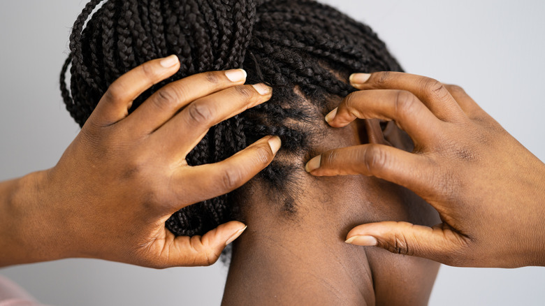 woman touching scalp