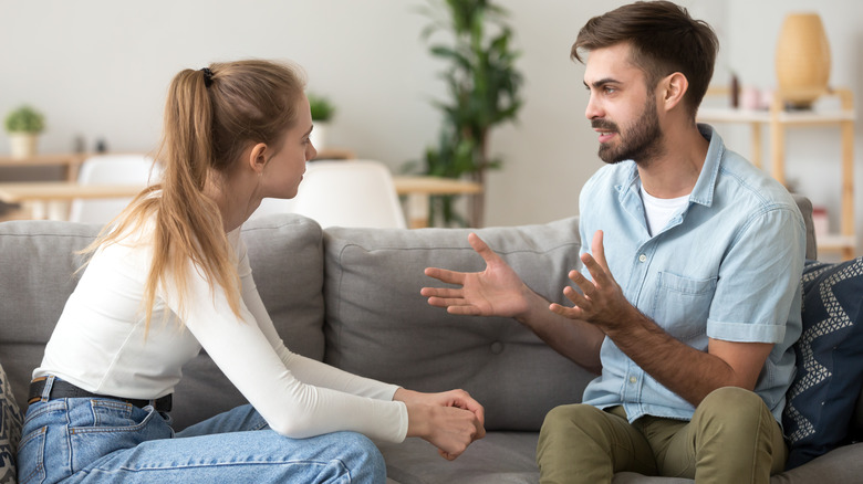 A man and woman talking