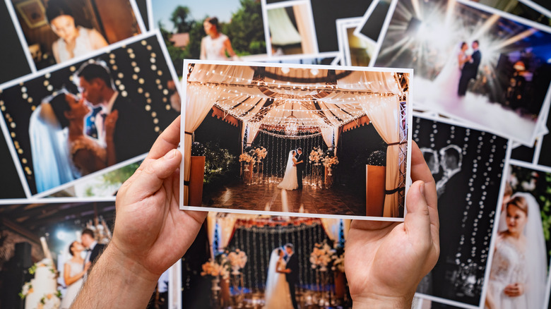 person looking at wedding pictures