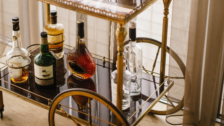 Bar cart with assorted liquor glasses