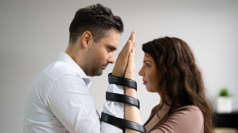 Couple chained together