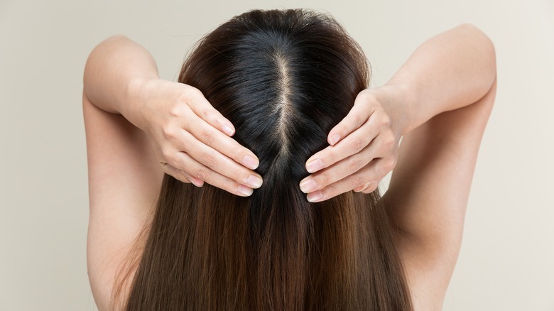 woman touching head