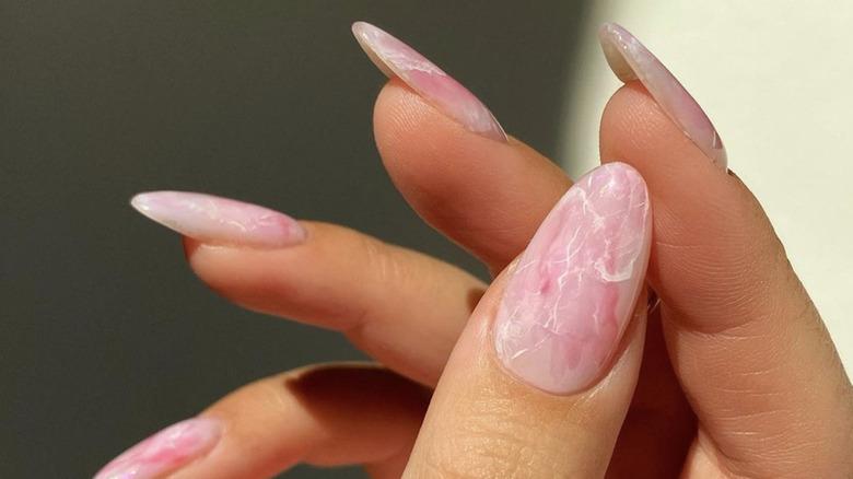 Close-up of rose quartz nails