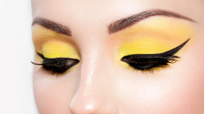 Woman with dramatic winged eyeliner