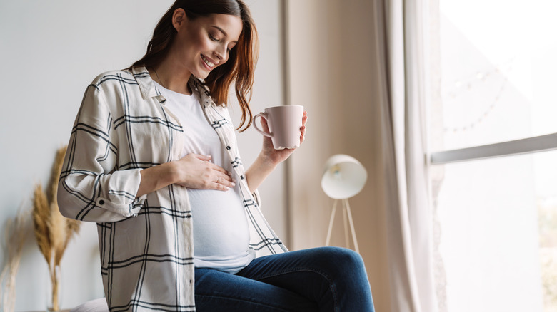 pregnant woman showing her bump