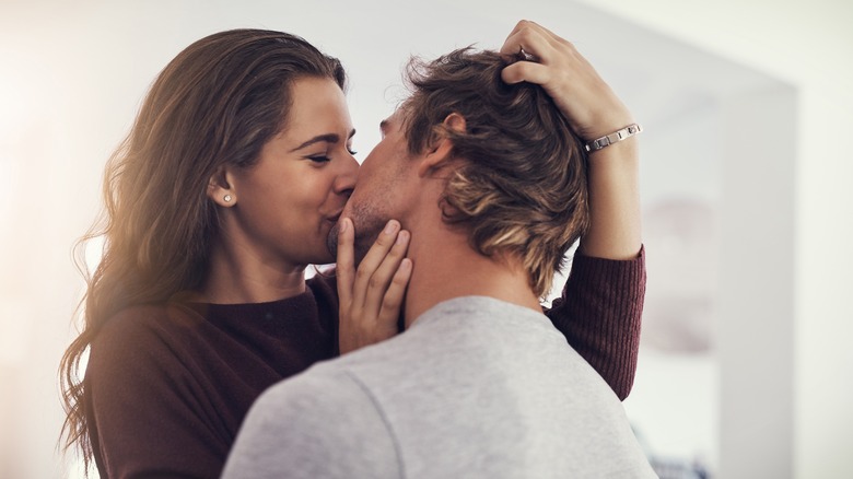 couple kissing and smiling