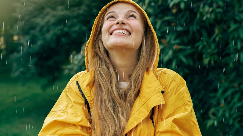 Woman wearing yellow raincoat