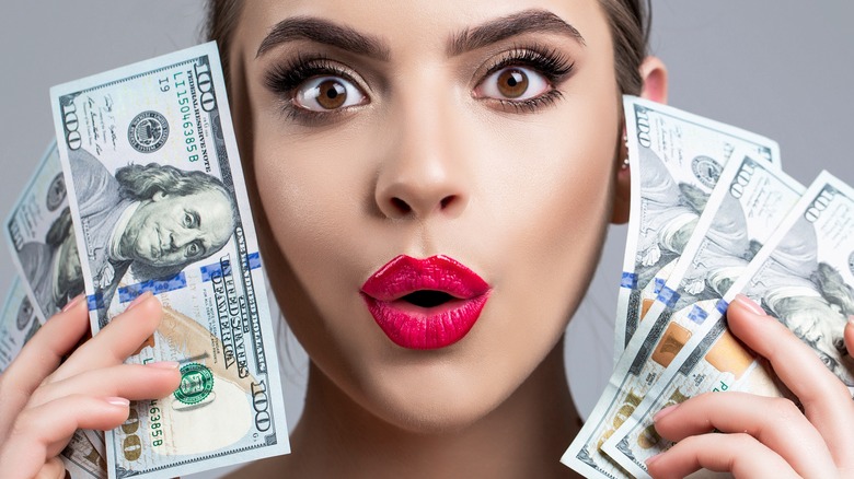 woman makeup money