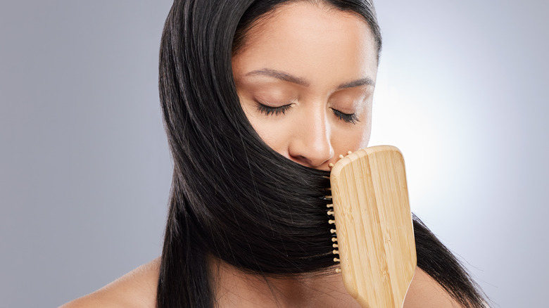 Woman smelling her hair 