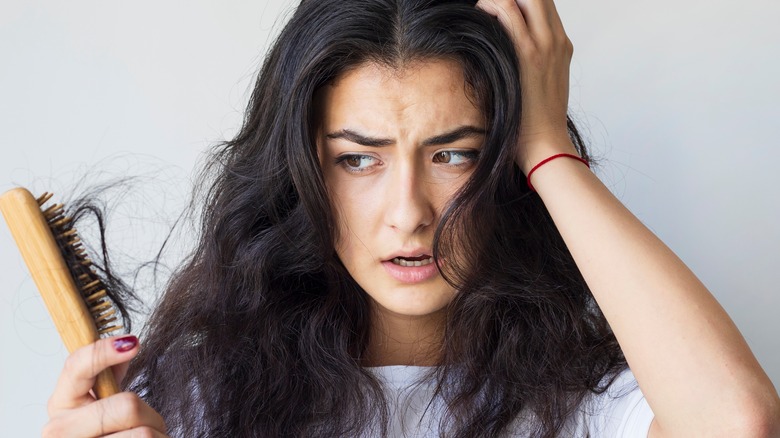 female clumps of hair on brush