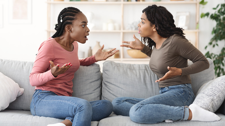 friends arguing on couch